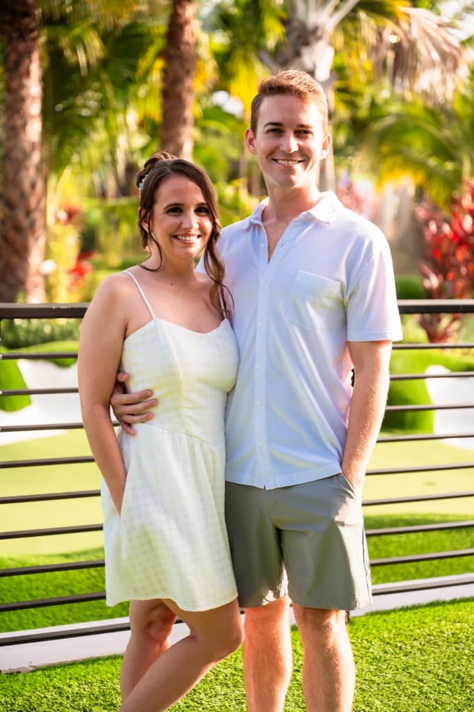 Husband-and-wife owners of Florida Social Rentals smiling together outdoors in South Florida.
